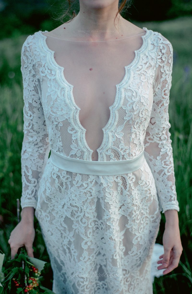 Backless wedding dress with shaped cut from behind by Anna Skoblikova