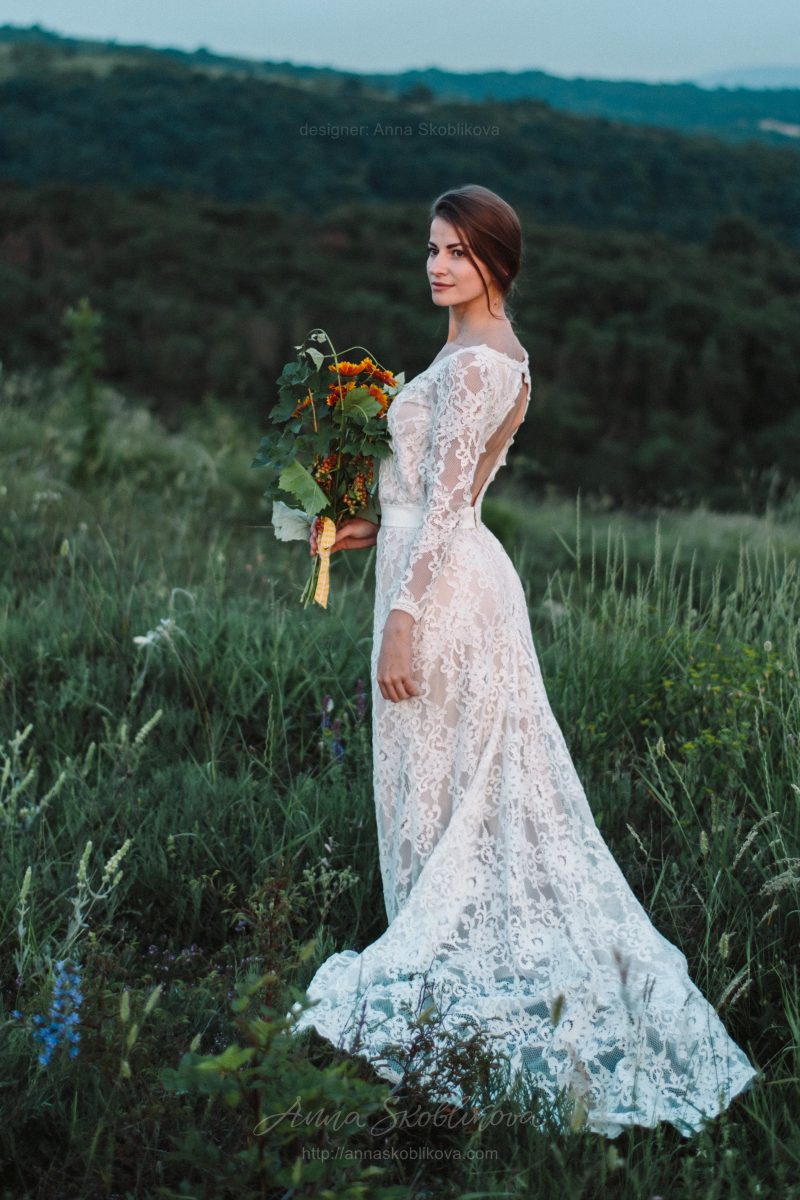 Backless wedding dress with shaped cut from behind by Anna Skoblikova