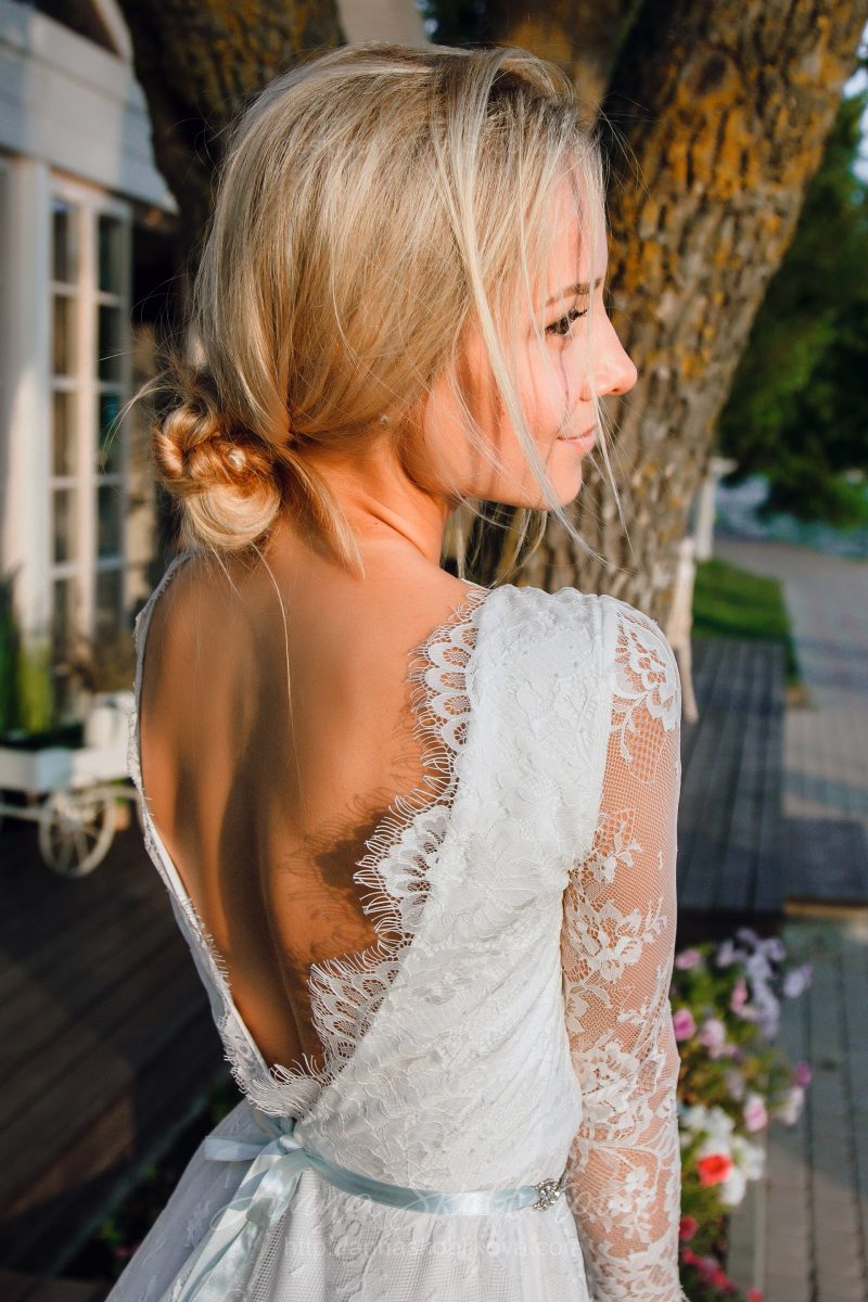Short lace wedding dress with a v-neck by Anna Skoblikova